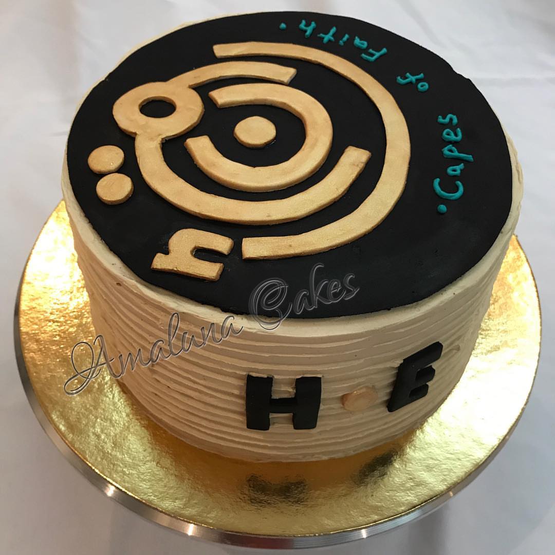 Capes of Faith Logo Cake! This was a moist chocolate cake and roasted hazelnut frosting with dark chocolate ganache ✨ Made with natural hazelnut paste, and organic cocoa powder! Check out @capesoffaith_abayas! #cakestagram #cakes #cakedecorating #cakeart #chocolate #organic #lowsugar #hazelnut #logo #riyadh #riyadhcakes #healthychoices #naturalingredients #abaya #gold