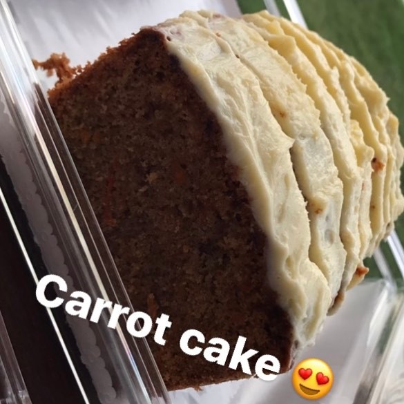 Carrot cake with nuts and cream cheese frosting