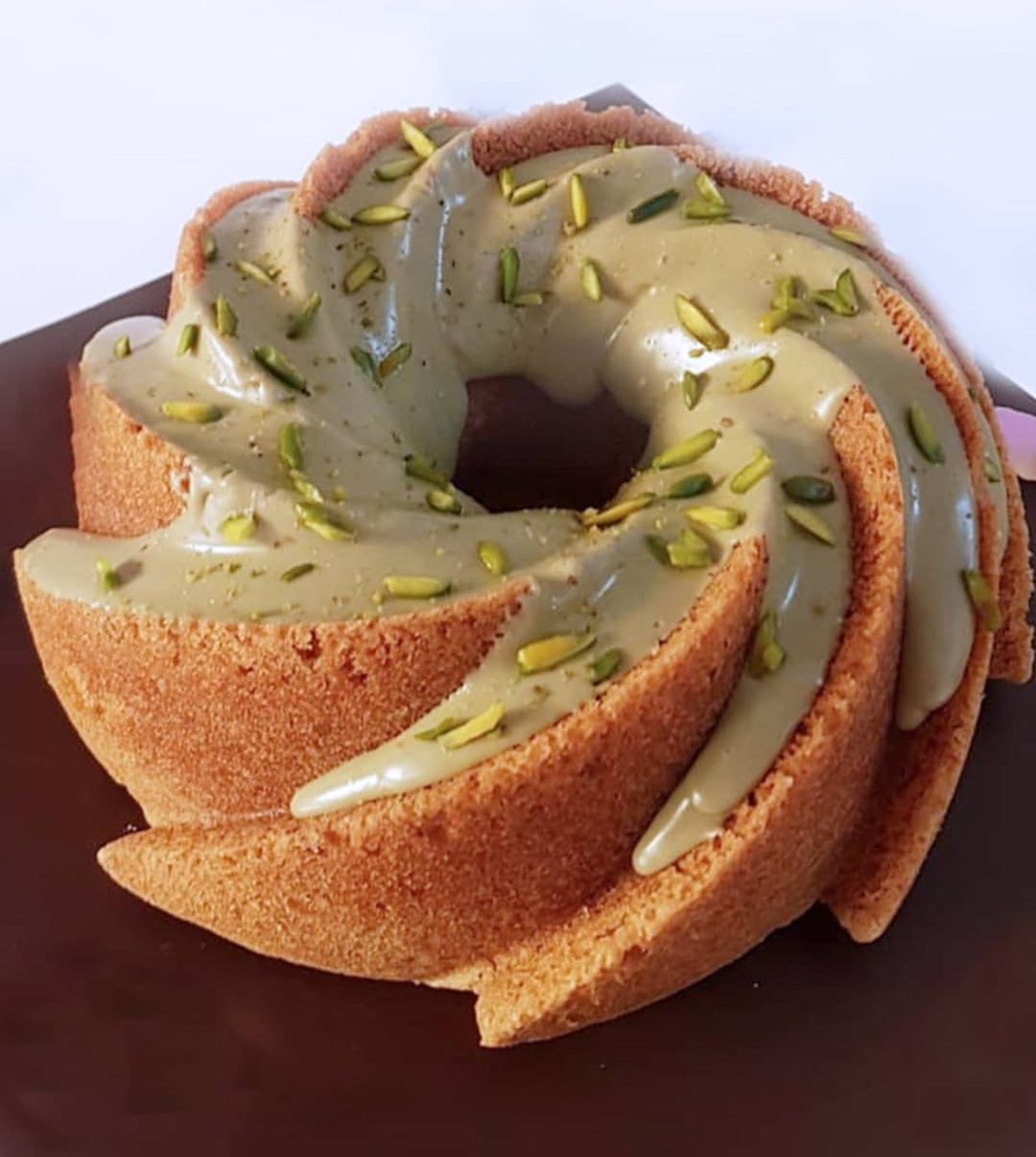 Fostoq Cake topped chocolate cream pistachio