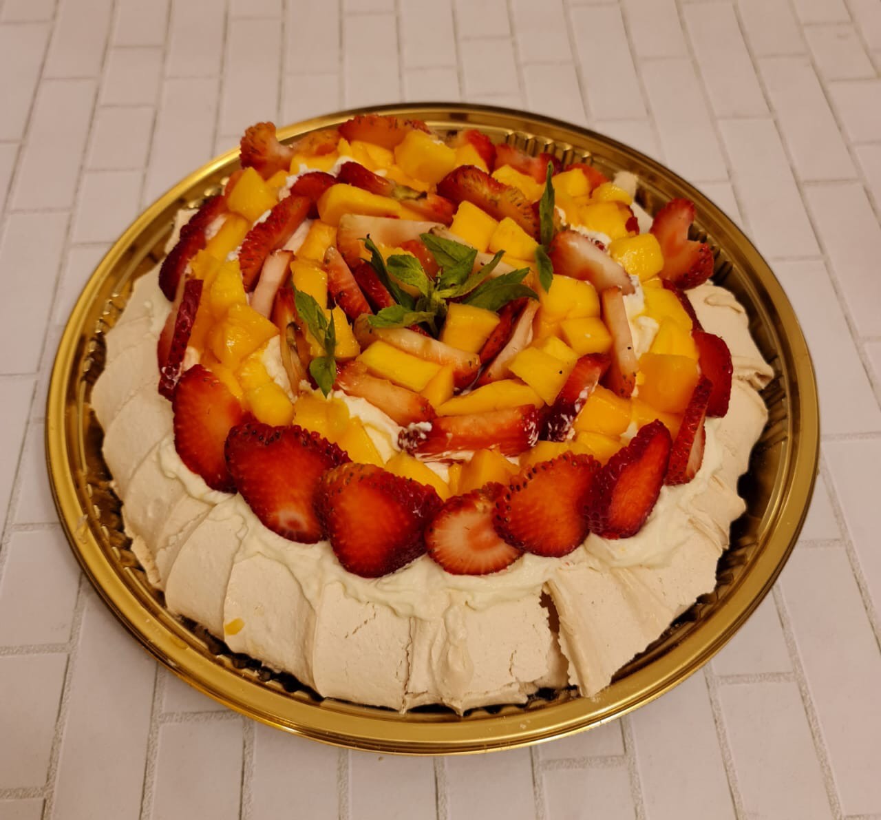 Pavlove with mango and strawberry